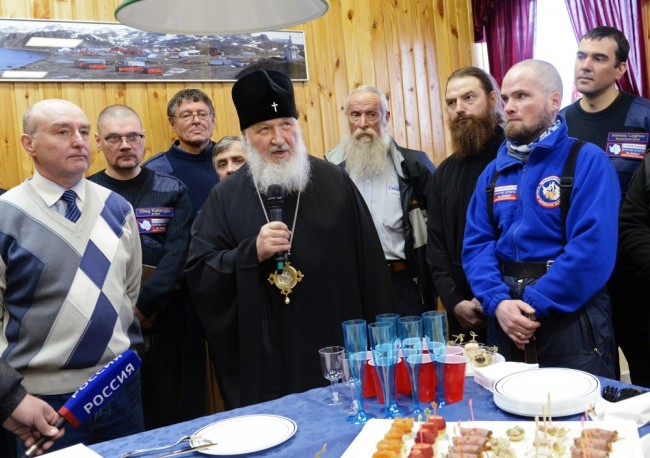 2793096 02/17/2016 Patriarch of Moscow and All Russia Kirill, center, meets with polar explorers during his visit to the Russian Bellingshausen polar station on King George island in Antarctica. Sergey Pyatakov/Sputnik