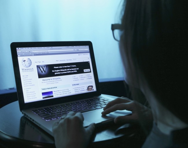 Wikipedia webpage in use on a laptop computer is seen in this photo illustration taken in Washington, January 17, 2012. Wikipedia, the popular community-edited online encyclopedia, will black out its English-language site for 24 hours to seek support against proposed U.S. anti-piracy legislation that  Wikipedia founder Jimmy Wales said threatens the future of the Internet.     REUTERS/Gary Cameron    (UNITED STATES - Tags: SCIENCE TECHNOLOGY CRIME LAW)