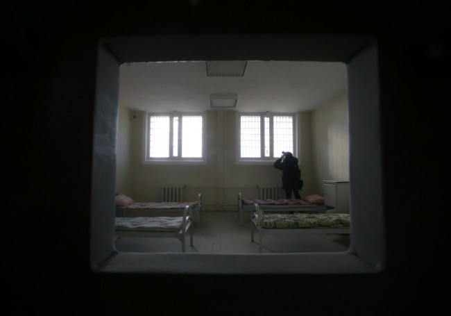 A man takes a picture in the ward at the new Investigative Isolator "Kresty-2" (Crosses-2) detention centre, which is under construction, in St. Petersburg, October 17, 2014. "Kresty-2", which will be the largest prison complex in Europe when it is finished as planned in 2016, has been designed for the maintenance of 4000 criminal suspects, according to a representative of the Russian Federal Penitentiary Service. REUTERS/Alexander Demianchuk (RUSSIA - Tags: CRIME LAW)