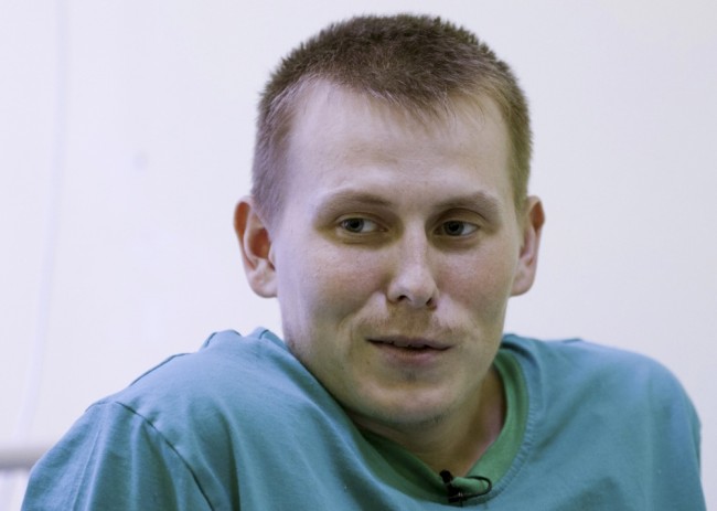 A man, who according to Ukraine's state security service (SBU) is named Alexander Alexandrov and is one of two Russian servicemen detained by Ukrainian forces, speaks during an interview with Reuters at a hospital in Kiev, Ukraine, in this May 28, 2015 file photo. The mother of a Russian soldier captured in Ukraine says her son never told her he was quitting the army, raising doubt about Kremlin assertions that the soldier was no longer serving when he crossed the frontier. Russia denies sending troops to help separatist fighters in east Ukraine and says Alexandrov and his commander, Captain Yevgeny Yerofeyev, had quit their special forces unit to go there on their own. To match Exclusive UKRAINE-CRISIS/SOLDIER REUTERS/Valentyn Ogirenko/Files