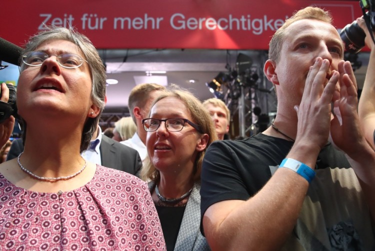 Supporters of the Social Democratic Party (SPD) react after first exit polls of the general election (Bundestagswahl) in Berlin, Germany, September 24, 2017. REUTERS/Michael Dalder