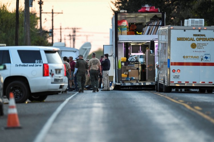 Medical personnel and law enforcement set up along a street near the First Baptist Church in Sutherland Springs, Texas, US., November 5, 2017.  REUTERS/Mohammad Khursheed