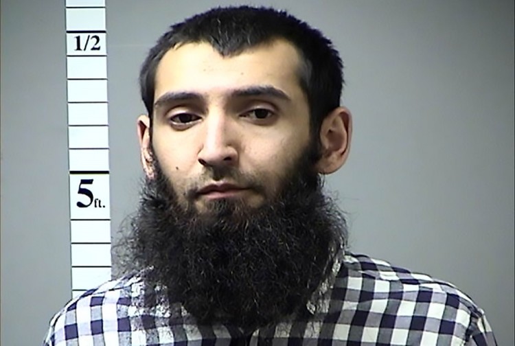 This handout photograph obtained courtesy of the St. Charles County Police Department on October 31, 2017 shows Saifullah Saipov, the suspectecd driver who killed eight people in New York on October 31, 2017, mowing down cyclists and pedestrians, before striking a school bus in what officials branded a "cowardly act of terror." Eleven others were seriously injured in the broad daylight assault and first deadly terror-related attack in America's financial and entertainment capital since the September 11, 2001 Al-Qaeda hijackings brought down the Twin Towers. In April of 2016 a warrant was issued in Missouri for his failure to pay a traffic citation.  / AFP PHOTO / ST. CHARLES COUNTY POLICE DEPARTMENT / == RESTRICTED TO EDITORIAL USE  / MANDATORY CREDIT:  "AFP PHOTO /  ST. CHARLES COUNTY POLICE DEPARTMENT " / NO MARKETING / NO ADVERTISING CAMPAIGNS /  DISTRIBUTED AS A SERVICE TO CLIENTS  ==