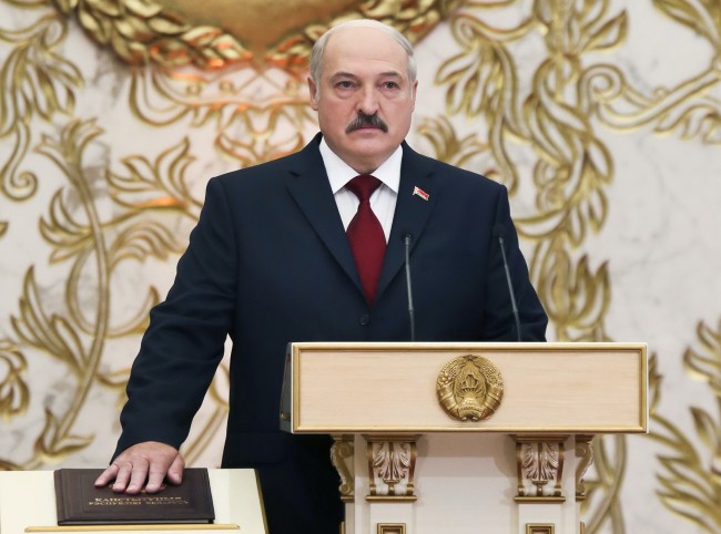 Belarusian President Alexander Lukashenko takes his oath of office during his inauguration ceremony at the Palace of the Independence in Minsk, Belarus, Friday, Nov. 6, 2015.  Lukashenko at his swearing-in ceremony on Friday rejected calls for economic reforms, shattering hopes for a liberalization inspired by a recent release of political prisoners and rapprochement with the West. (Nikolai Petrov, Pool Photo via AP)