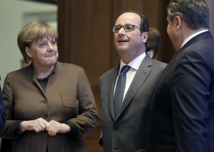 Ангела Меркель и Франсуа Олланд. Фото AP Photo/Scanpix