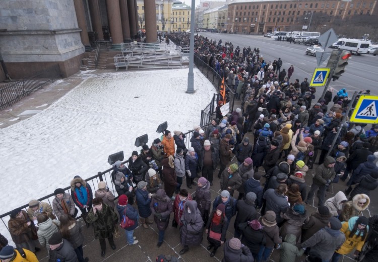 People formed a live circle around the St. Isaac's Cathedral as a symbol of protection in St.Petersburg, Russia, Sunday, Feb. 12, 2017. About 2,500 people rallied in St. Petersburg on Sunday against the decision of the city authorities to hand over the city's landmark St. Isaac's Cathedral to the Russian Orthodox Church. (AP Photo/Dmitri Lovetsky)