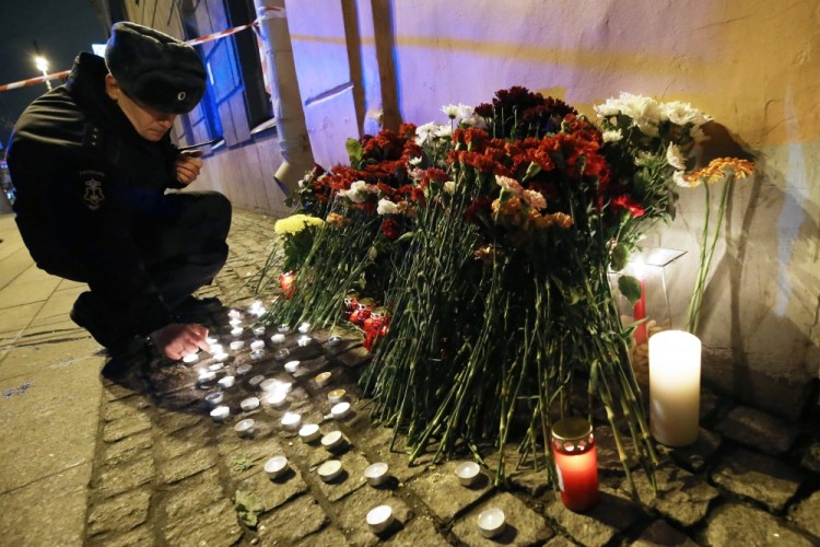 ST PETERSBURG, RUSSIA - APRIL 3, 2017: Flowers and candles in memory of the St Petersburg Metro explosion victims at Tekhnologichesky Institut station. A blast hit a train carriage between Sennaya Ploschad and Tekhnologichesky Institut stations of the St Petersburg Underground on April 3, 2017, killing at least 10 and injuring 50 people. Peter Kovalev/TASS