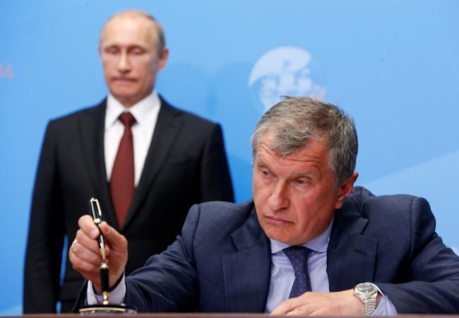 Российский президент Владимир Путин и президент «Роснефти» Игорь Сечин. Фото: Reuters / Scanpix
