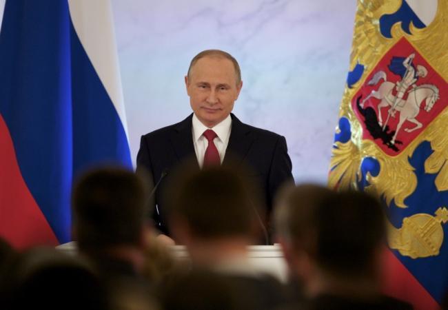 Президент России в Георгиевском зале Кремля выступает с обращением к Федеральному посланию. Кадр видеотрансляции.