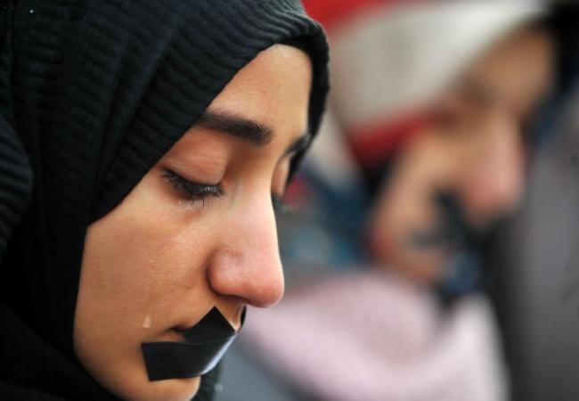 Мусульманская женщина на митинге в Сараево. Фото: AFP / Scanpix