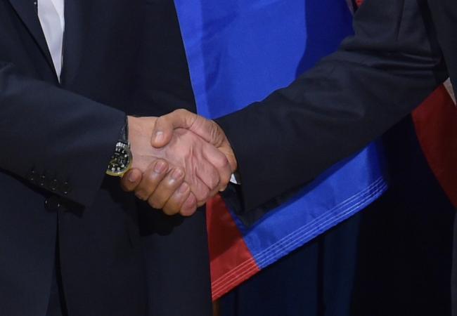 Рукопожатие Владимира Путина и Барака Обамы во время недавней встречи двух лидеров в Нью-Йорке. Фото AFP/Scanpix