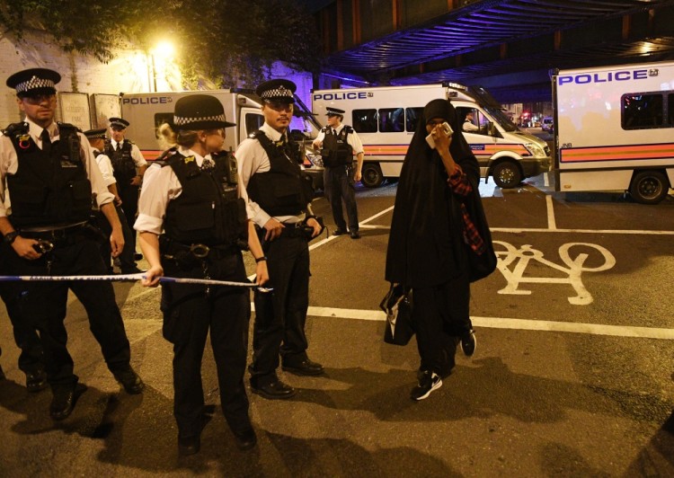 epa06036563 Onlookers walk by a police cordon near Finsbury Park, after a van collision incident in north London, Britain, 19 June 2017. According to the Metropolitan Police Service, police responded on 19 June, to reports of a major incident where a vehicle collided with pedestrians in Seven Sisters Road, in north London. One man was pronounced dead at the scene and at least eight people were injured, police said. The driver of the van, a 48-year-old man, has been detained. An investigation into the circumstances of the incident is being carried out by the Counter Terrorism Command. The Muslim Council of Britain (MCB) commented on the incident saying that a van has run over worshippers outside the Muslim Welfare House (MWH), near the Finsbury Park Mosque. British Prime Minister Theresa May described the attack as a 'terrible incident.'  EPA/FACUNDO ARRIZABALAGA