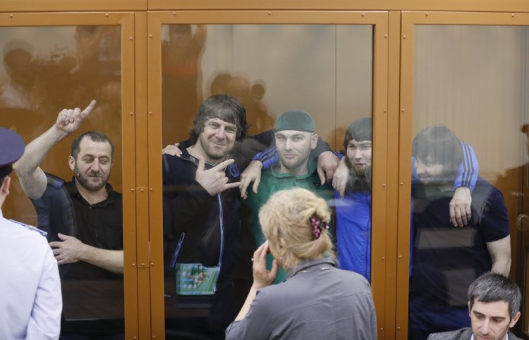 epaselect epa06082965 Convicts in the Nemtsov murder case: (L-R) Khamzat Bakhayev, Temirlan Eskerkhanov,  Shadid Gubashev, Anzor Gubashev and Zaur Dadayev, smile while hearing the prosecutor's plea at the Moscow district military court in Moscow, Russia, 12 July 2017. The prosecutor demands a long-life sentence for Zaur Dadayev and long term imprisonment for the others. A jury on 29 June 2017 found the five suspects guilty of involvement in the murder of Boris Nemtsov. Russian opposition leader Boris Nemtsov was shot dead from a passing car on the Bolshoy Kammeny bridge near the Kremlin on 27 February 2015. Others are not identified.  EPA/YURI KOCHETKOV