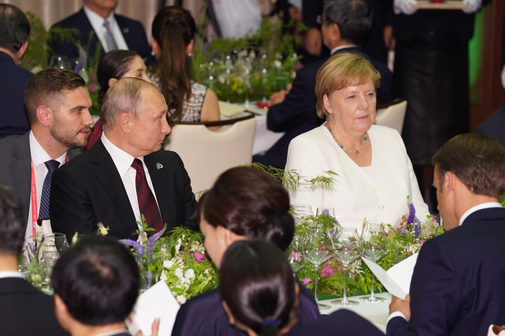 Владимир Путин и Ангела Меркель на саммите G20 в Осаке, июнь 2019 г. Фото: G20 HANDOUT / TASS / Scanpix / Leta