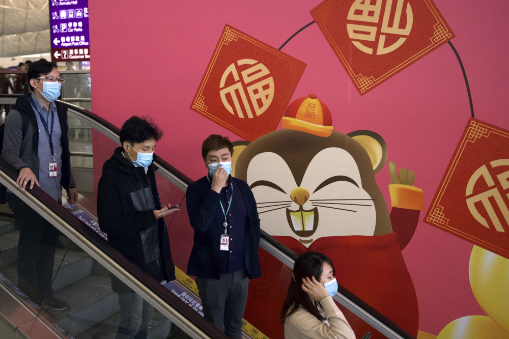 Люди в масках в Гонконге. Фото: Ng Han Guan / TASS / Scanpix / Leta