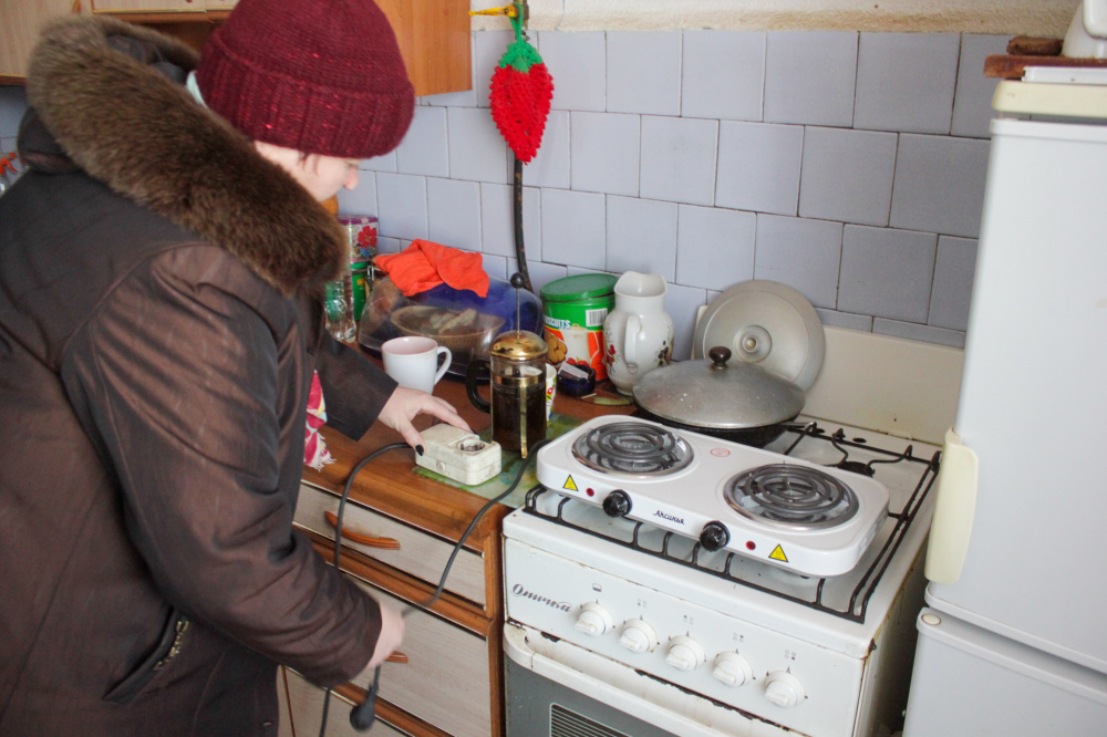 Женщина на кухне. Фото: Yevgeny Sofiychuk / TASS / Scanpix / Leta