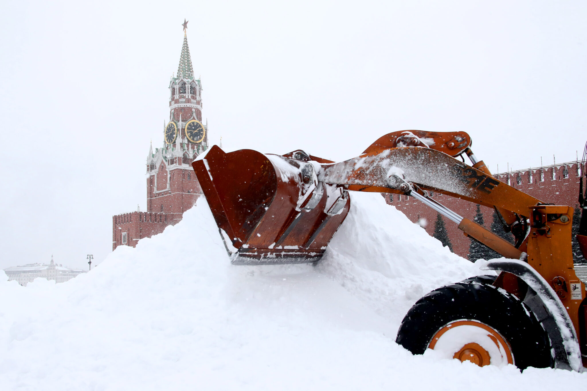 MOSCOW, RUSSIA - FEBRUARY 13, 2021: A snow plow clears Moscow's Red Square of snow during a snowfall. Valery Sharifulin/TASS