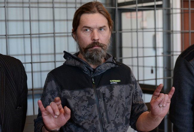 2352071 01/24/2014 Sergei “Pauk” Troitsky, the leader of the punk metal group Korrozia Metalla, at the Novosibirsk Region's Obskoy Court, shortly before a hearing to qualify his actions at the Tolmachovo international airport and to determine potential pretrial restrictions. The musician engaged in a conflict with the airline over bottled liquids found in his carry-on luggage during a personal check. Alexandr Kryazhev/RIA Novosti