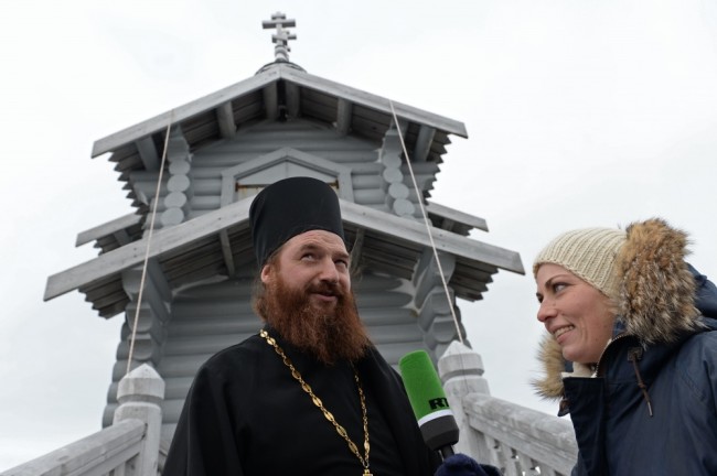 2793136 02/17/2016 Senior priest of the Trinity Church at the Russian Bellingshausen station deacon Maxim Gerb talks to journalists on King George island in Antarctica. Patriarch of Moscow and All Russia Kirill paid a visit to the Russian Bellingshausen polar station on the island. Sergey Pyatakov/Sputnik
