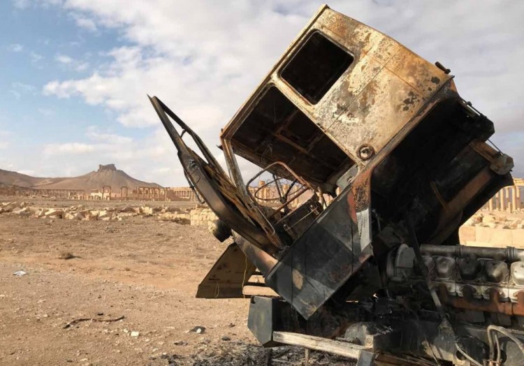 3041908 03/03/2017 The cab of the truck burned down not far from the historical and architectural center of ancient Palmyra in the Syrian province of Homs. Palmyra has been recaptured by Syrian government forces with Russia's support. The best possible quality. Михаил Алаеддин/Sputnik