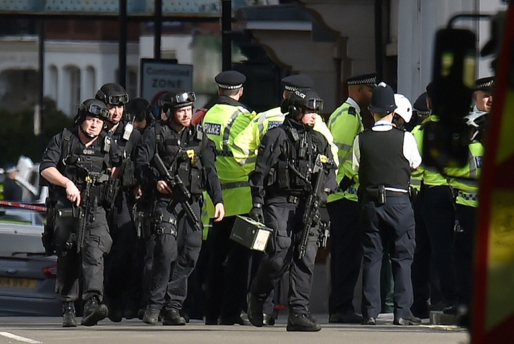 Armed police close to Parsons Green station in west London after an explosion on a packed London Underground train.