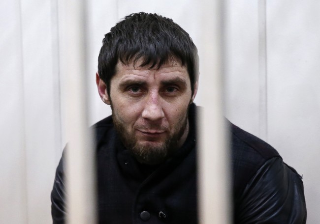 Zaur Dadayev, charged with involvement in the murder of Russian opposition figure Boris Nemtsov, looks out from a defendants' cage inside a court building in Moscow, March 8, 2015. Russian authorities said on Sunday they were holding five men over the killing of Kremlin critic Boris Nemtsov, one of whom served in a police unit in the Russian region of Chechnya, according to a law enforcement official. A judge ruled that all five should be held in custody and said that one of them, Zaur Dadayev, had admitted his involvement in the killing when questioned by investigators. REUTERS/Tatyana Makeyeva (RUSSIA  - Tags: CRIME LAW POLITICS)