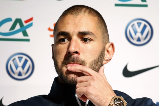 France's national soccer team player Karim Benzema attends a news conference in Clairefontaine, near Paris, in this October 7, 2014 file photo. France soccer International and Real Madrid striker Karim Benzema was placed under formal investigation by a French court in connection with an inquiry into an alleged attempt to blackmail fellow-France soccer international Mathieu Valbuena according to French media.  Picture taken October 7, 2014.   REUTERS/Charles Platiau/Files    TPX IMAGES OF THE DAY