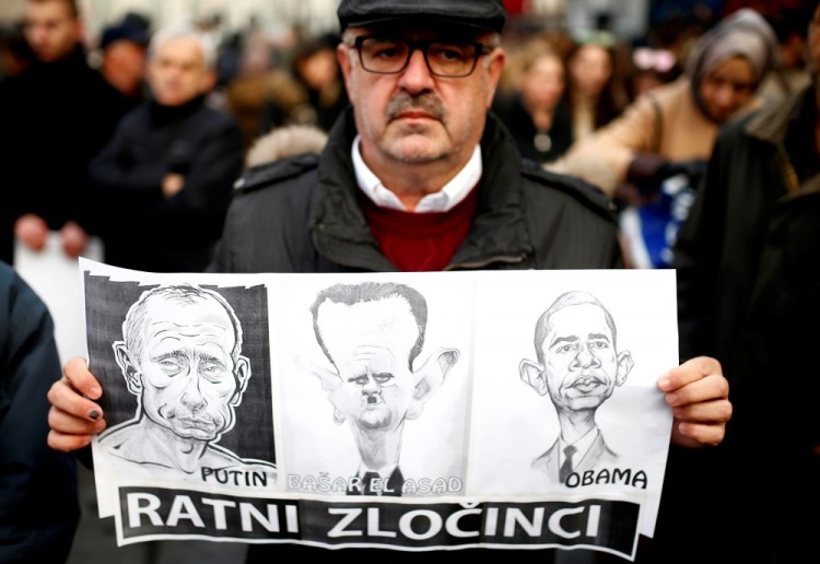 При этом для некоторых демонстрантов Путин, Асад и Барак Обама — в равной степени военные преступники. Фото: Reuters / Scanpix