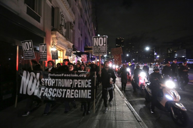 People march to Trump tower after a rally against U.S. President-elect Donald Trump in Manhattan, New York City, U.S., January 19, 2017. REUTERS/Stephen Yang