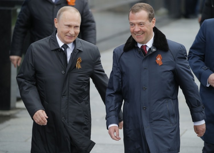 Moscow - Russia - 09/05/2017 - Russian President Vladimir Putin and Prime Minister Dmitry Medvedev arrive for the Victory Day military parade marking the World War II anniversary at Red Square in Moscow. REUTERS/Yuri Kochetkov/Pool