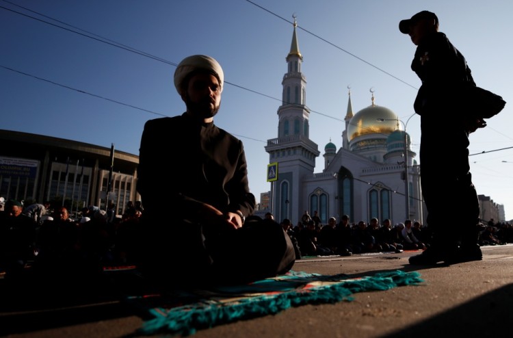 People attend prayers for the Muslim holiday of Eid al-Adha in Moscow, Russia September 1, 2017. REUTERS/Maxim Shemetov