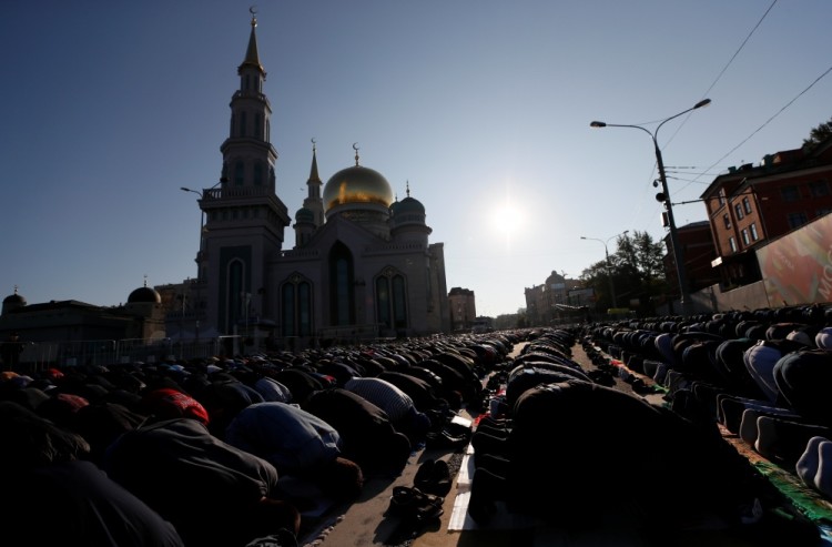 People attend prayers for the Muslim holiday of Eid al-Adha in Moscow, Russia September 1, 2017. REUTERS/Maxim Shemetov