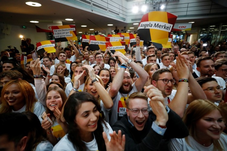 People at the Christian Democratic Union CDU headquarters react on first exit polls in the German general election (Bundestagswahl) in Berlin, Germany, September 24, 2017. REUTERS/Kai Pfaffenbach