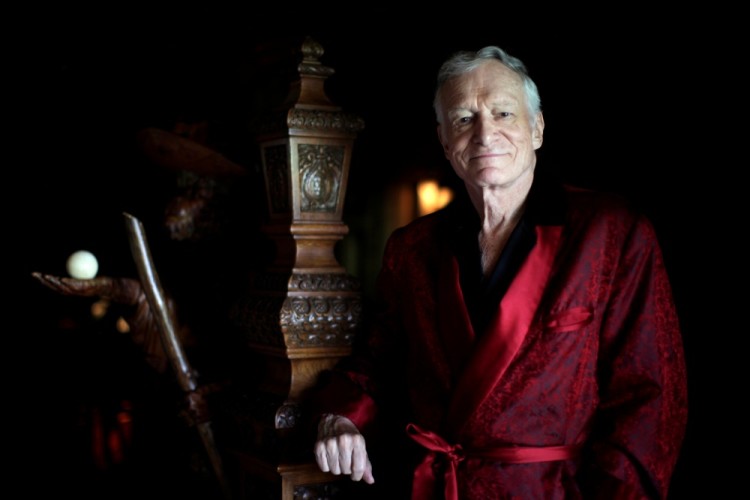 FILE PHOTO -  Playboy magazine founder Hugh Hefner poses for a portrait at his Playboy mansion in Los Angeles, California July 27, 2010. REUTERS/Lucy Nicholson/File Photo
