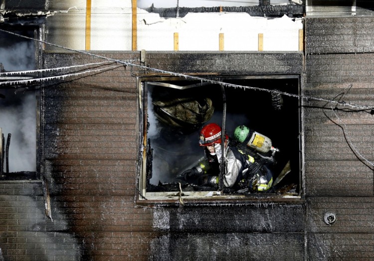 A firefighter inspects a facility to support senior people on welfare, where a fire occurred, in Sapporo, Japan, in this photo taken by Kyodo on February 1, 2018. Mandatory credit Kyodo/via REUTERS ATTENTION EDITORS - THIS IMAGE WAS PROVIDED BY A THIRD PARTY. EDITORIAL USE ONLY. MANDATORY CREDIT. JAPAN OUT. NO COMMERCIAL OR EDITORIAL SALES IN JAPAN.     TPX IMAGES OF THE DAY