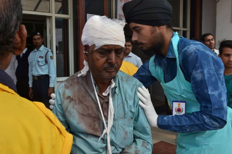 An injured Indian passenger is treated at a hospital in Kanpur on November 20, 2016 after a deadly train derailment. A passenger train derailed in northern India on November 20, killing at least 63 travellers most of whom were sleeping when the fatal accident occurred, police said. Rescue workers rushed to the scene near Kanpur in Uttar Pradesh state where the Patna-Indore express train derailed in the early hours of the morning.  / AFP PHOTO / -