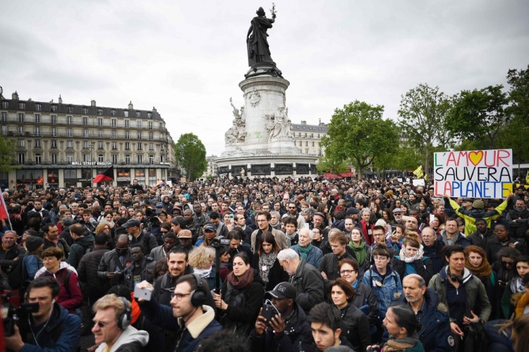 TOPSHOT - People gather Place de la Republique (Republic Square) during a demonstration called by the collectif 