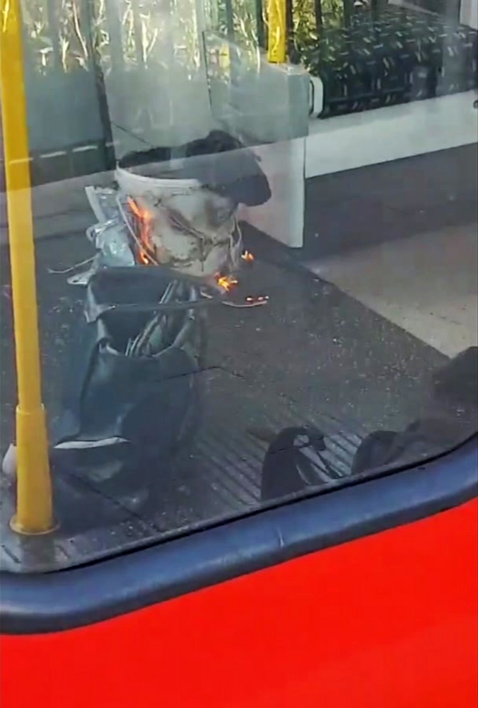 This is an image made from video showing burning items in underground train at the scene of an explosion in London Friday, Sept. 15, 2017. A reported explosion at a train station sent commuters stampeding in panic, injuring several people at the height of London's morning rush hour, and police said they were investigating it as a terrorist attack. (Sylvain Pennec via AP)