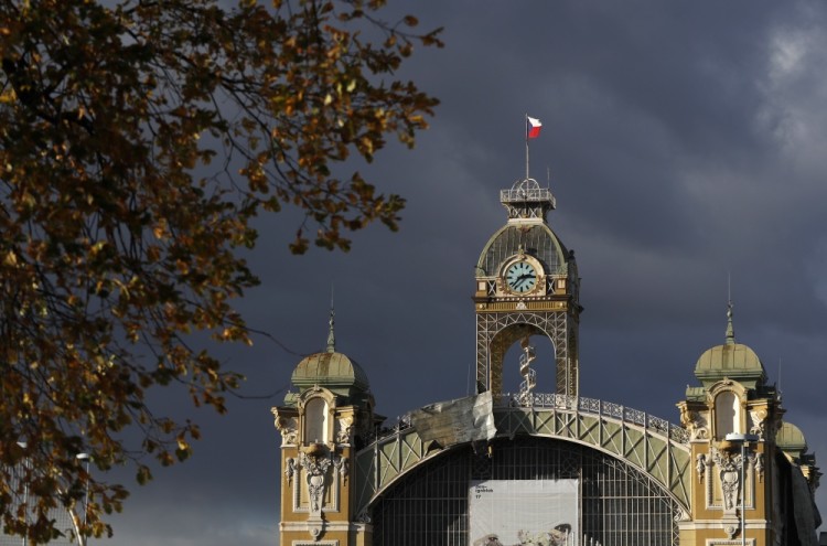 A roof damaged by strong wind hangs from the Trade Fair Palace in Prague, Czech Republic, Sunday, Oct. 29, 2017. At least two persons have died in Czech Republic as high winds have struck the country. (AP Photo/Petr David Josek)