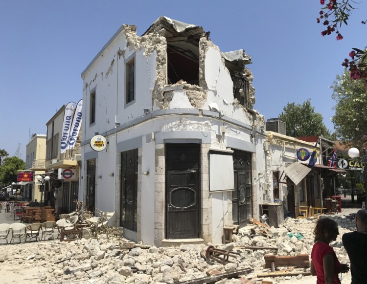 Rubble sit outside a bar where two people have been killed after an earthquake in Kos on the island of Kos, Greece Friday, July 21, 2017. Greek authorities said two tourists killed in the overnight quake are from Turkey and Sweden.(AP Photo/Michael Probst)