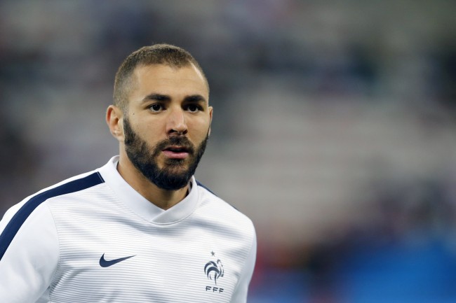 (FILES) -- This file photo taken on October 8, 2015 at the Allianz Riviera stadium in Nice shows France's forward Karim Benzema prior to the friendly football match between France and Armenia. French footballer Karim Benzema was arrested on November 4, 2015 after being accused of blackmail related to a sextape featuring fellow player Mathieu Valbuena, a source close to the probe told AFP. AFP PHOTO / VALERY HACHE