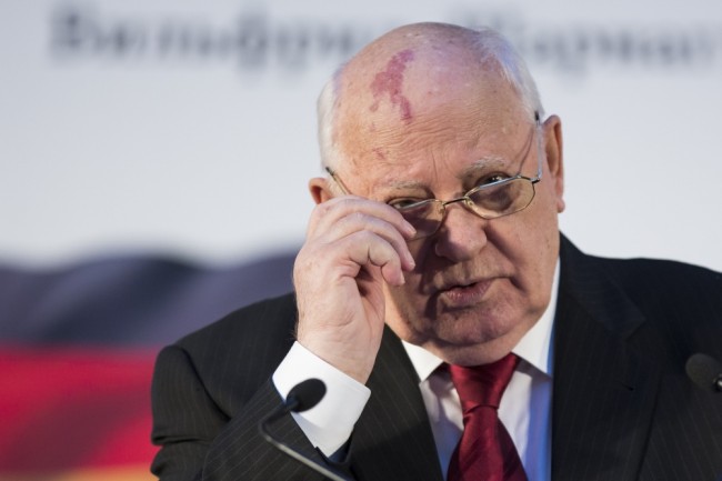 Former Soviet President Mikhail Gorbachev adjusts his glasses as he addresses Russian and German political scientists in Moscow, Russia, Tuesday, July 21, 2015. Gorbachev, 84, made a rare public appearance on Tuesday to attend a book presentation of a German political scientist. (AP Photo/Alexander Zemlianichenko)