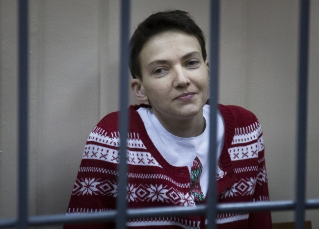 FILE In this Wednesday, March 4, 2015 file photo Ukrainian jailed military officer Nadezhda Savchenko sits in a cage at a court room in Moscow, Russia. A preliminary hearing in the trial of military pilot Nadezhda Savchenko charged in the deaths of two Russian journalists has started Thursday, July 30, 2015, in Russia's southern town of Donetsk. (AP Photo/Ivan Sekretarev, file)