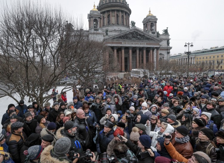 Protesters against the transfer of St. Isaac's Cathedral to the Russian Orthodox Church gather in front of the St. Isaac's Cathedral in St. Petersburg, Russia, Sunday, Feb. 12, 2017. About 2,500 people rallied in St. Petersburg on Sunday against the decision of the city authorities to hand over the city's landmark St. Isaac's Cathedral to the Russian Orthodox Church. (AP Photo/Dmitri Lovetsky)