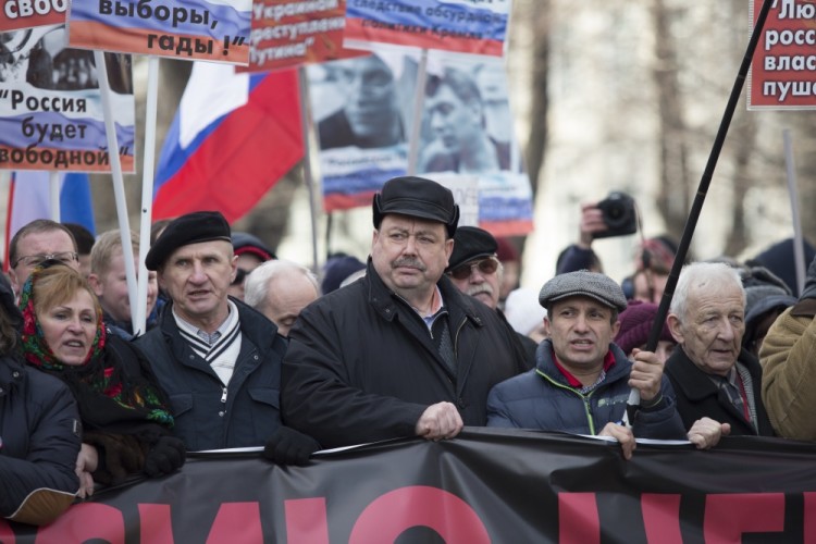 Russian former opposition lawmaker Gennady Gudkov, center, takes part in a march in memory of opposition leader Boris Nemtsov in Moscow, Russia, Sunday, Feb. 26, 2017. Thousands of Russians take to the streets of downtown Moscow to mark two years since Nemtsov was gunned down outside the Kremlin. (AP Photo/Ivan Sekretarev)