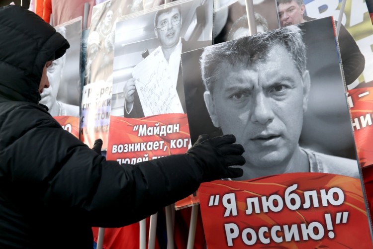 MOSCOW, RUSSIA - FEBRUARY 26, 2017: A participant in a march in memory of Russian politician Boris Nemtsov on the eve of the 2nd anniversary of his death. Boris Nemtsov was shot dead in the evening of February 27, 2015. Sergei Fadeichev/TASS