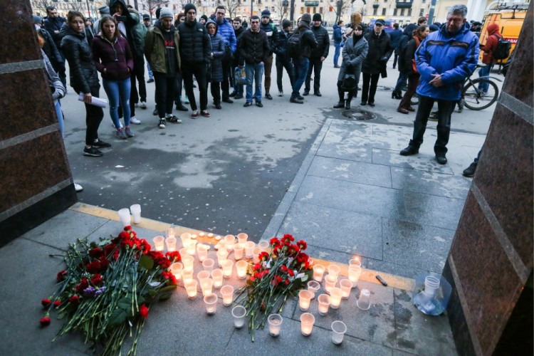 ST PETERSBURG, RUSSIA - APRIL 3, 2017: Flowers and candles in memory of the St Petersburg Metro explosion victims at Sennaya Ploshchad station. A blast hit a train carriage between Sennaya Ploschad and Tekhnologichesky Institut stations of the St Petersburg Underground on April 3, 2017, killing at least 10 and injuring 50 people. Alexander Demianchuk/TASS