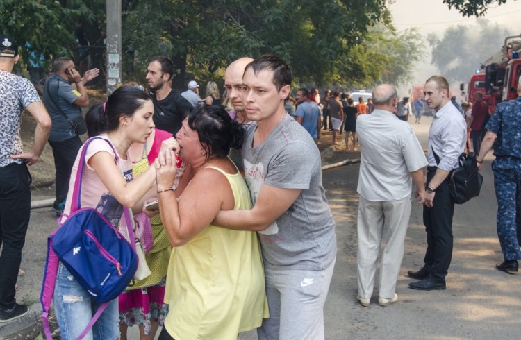 ROSTOV-ON-DON, RUSSIA - AUGUST 21, 2017: Local residents seen at the site of the fire in a residential area in the city centre. Yevgeny Dubrovsky/TASS