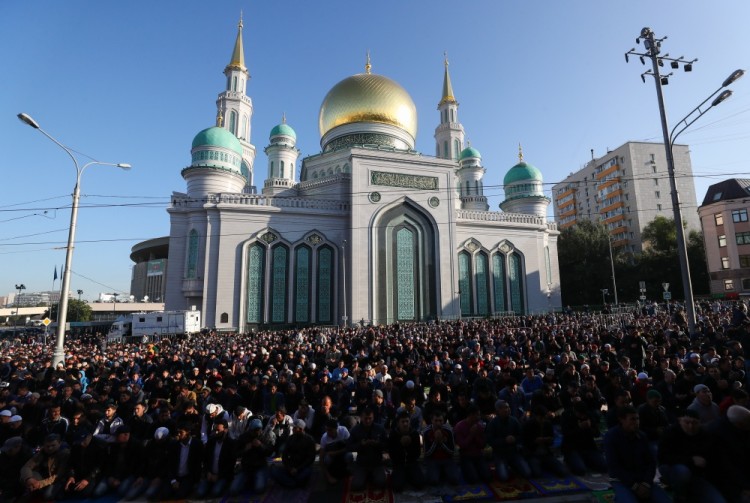 MOSCOW, RUSSIA - SEPTEMBER 1, 2017: Muslims pray outside the Moscow Cathedral Mosque on Eid al-Adha, also known as the Feast of the Sacrifice. Valery Sharifulin/TASS