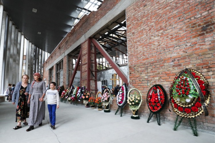 BESLAN, RUSSIA - SEPTEMBER 1, 2017: Wreaths seen outside School No 1 during an event in memory of the victims of the 2004 Beslan school siege. On September 1, 2004, a group of Chechen militants took more than 1,200 people hostage; the hostage crisis lasted for 3 days, leaving 334 people dead, including 186 children. Sergei Savostyanov/TASS